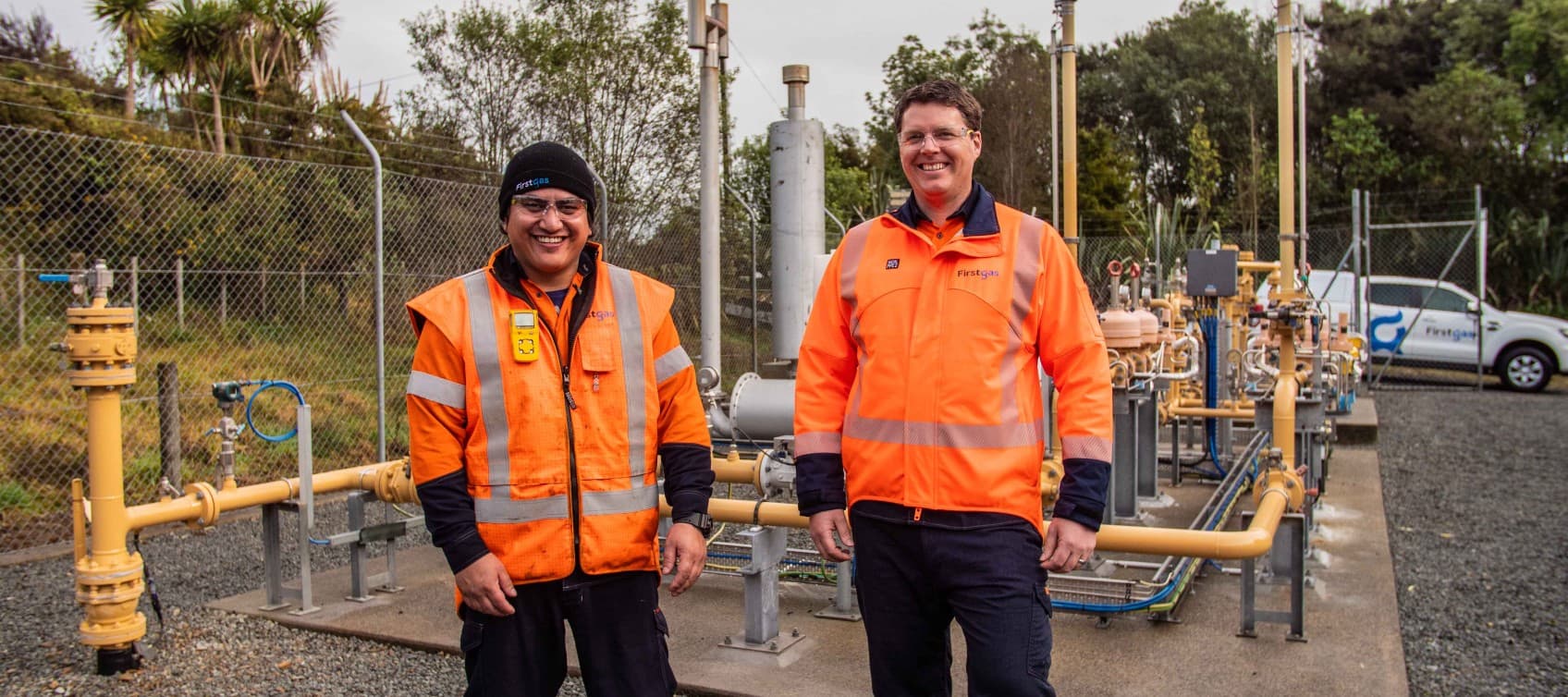 Two Firstgas people Firstgas station and FG car in background lowres