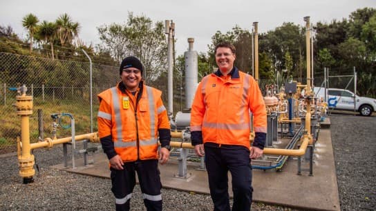 Two Firstgas people Firstgas station and FG car in background lowres